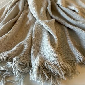 Soft cuddly throw blanket in two shades of pale grey, fringed ends, New w/o Tags